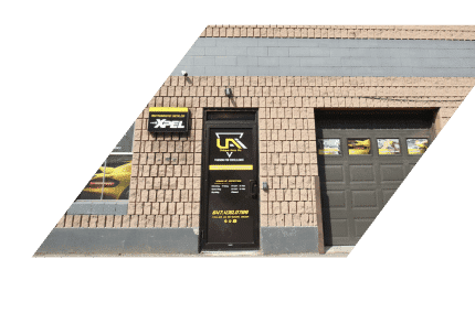 a building with a door and garage doors